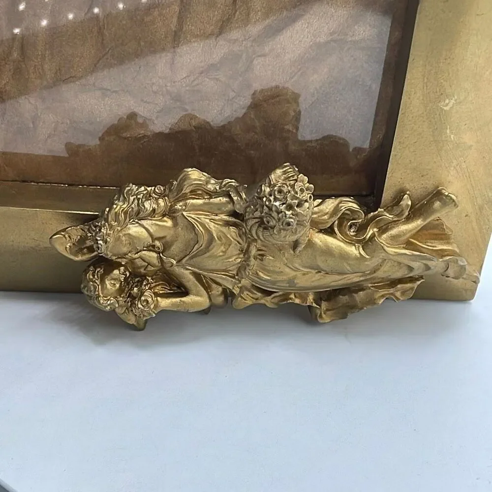 Vintage 1990 Gold colored Goddess & Cherub photo frame .